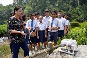 TINKERING... Yusof Ishak Secondary School students built a remotely operated underwater vehicle to measure the temperature, clarity and quality of the water, as part of their Applied Learning Programme. 